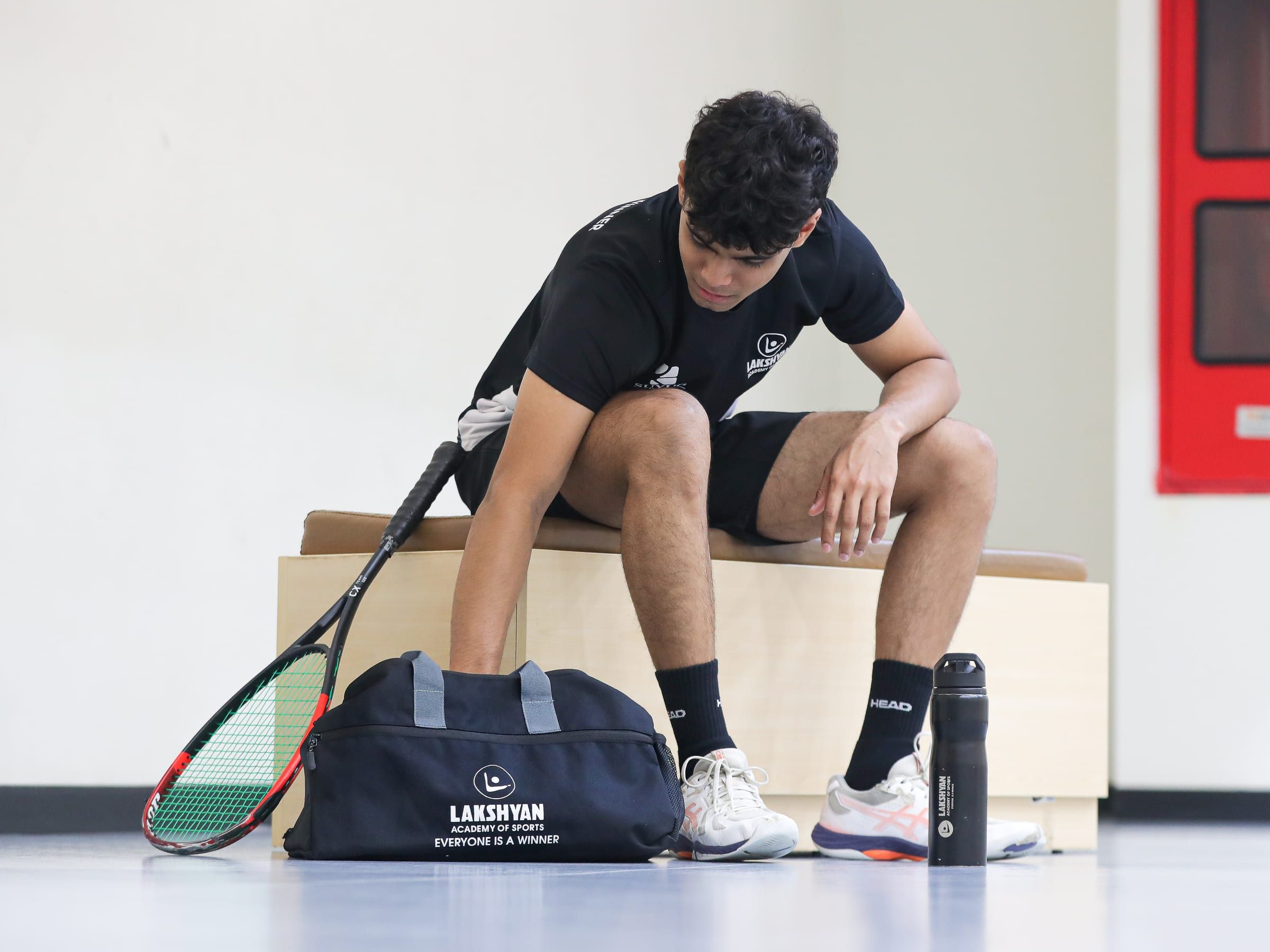 A player on the bench before a session